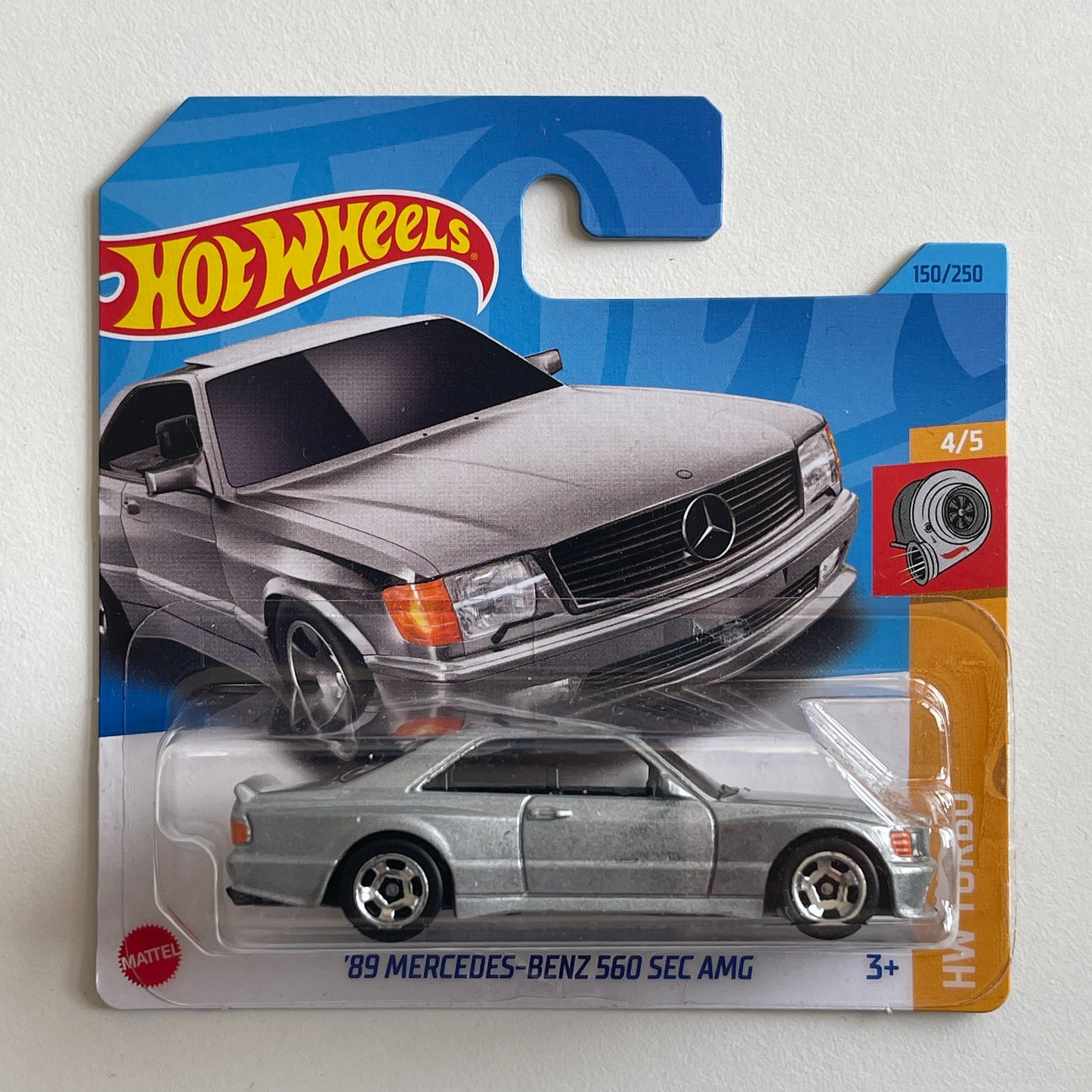 Hot Wheels '89 Mercedes - Benz 560 SEC AMG (sivá)