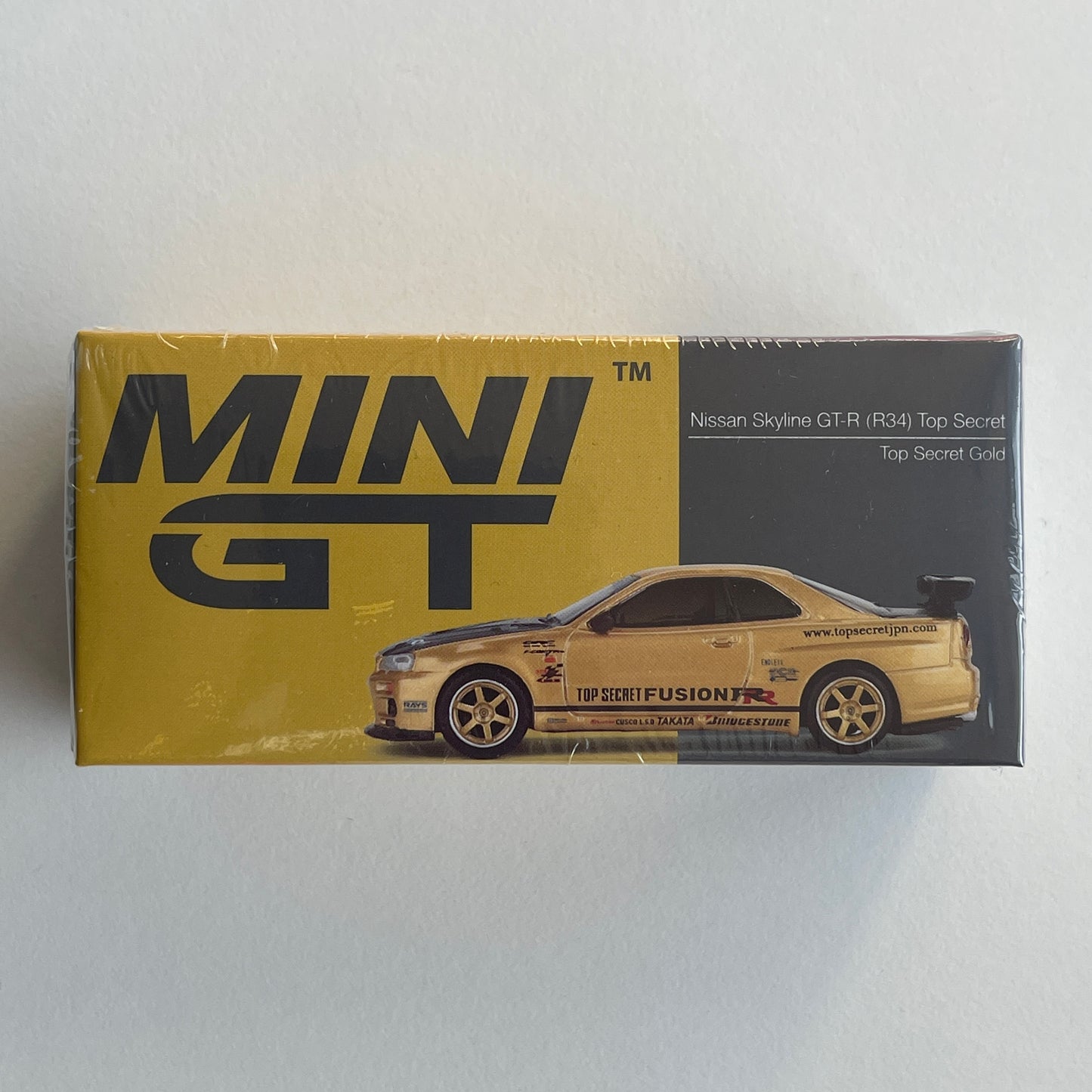 MiniGT #676 Nissan Skyline GT-R (R34) Top Secret Top Secret Gold Japan Exclusive